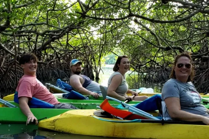 a group of people riding on the back of a boat