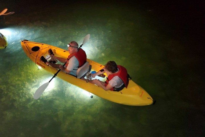 a man riding a wave on a surfboard in the water