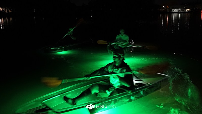 People in a kayak on sharkey’s glass bottom night tour People in a kayak on sharkey's glass bottom night tour