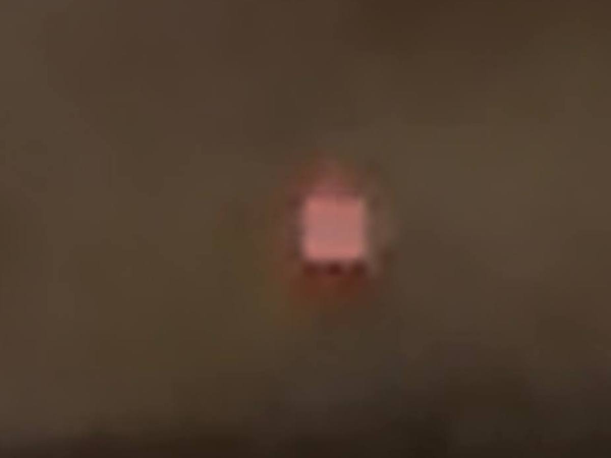 Blurry small pink rectangle on dark background